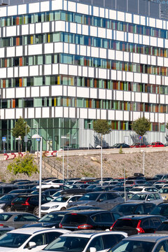 Parking in Stockholm Sweden shows cars and vehicles packed in urban density where transport infrastructure and mobility shape the busy lot