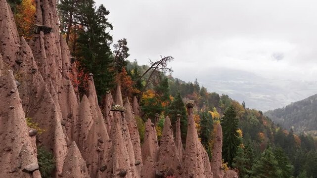 Earth pyramids of Platten at daytime, aerial view, at autumn season time.