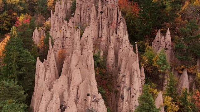 Earth pyramids of Platten at daytime, aerial view, at autumn season time.