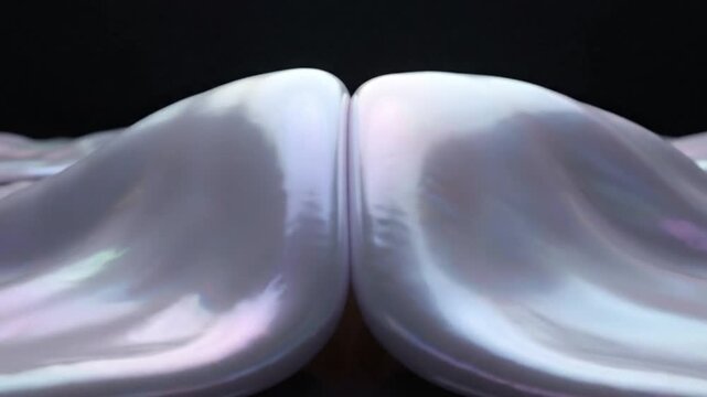 premium abstract loop featuring glossy pearl membranes stretching and merging organically