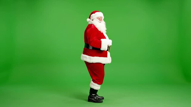 Full shot of Santa Claus in his iconic red suit, standing in profile on a green screen background. Ideal for holiday greetings, advertisements, and festive content.