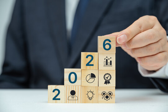 Businessman plan strategy marketing and finance to goal in 2026 planning business growth with technology AI and environmental care to New Year resolutions business.