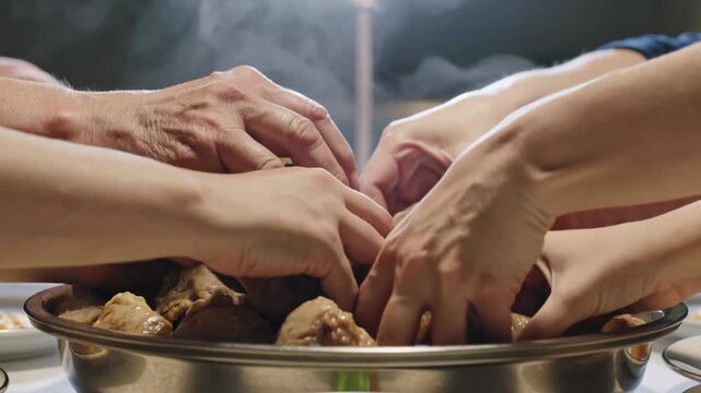 Sharing hearts and hands connect over a steaming platter of savory, comforting meatballs during a special meal