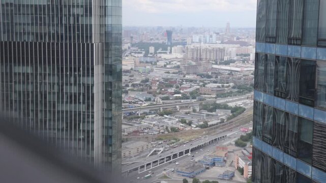 Moscow, Russia. - June 13, 2025: View of the city from the high floor of one of the elevators in the Moscow City business center. City streets