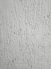 Fototapeta premium Whitewashing a plastered wall for a background