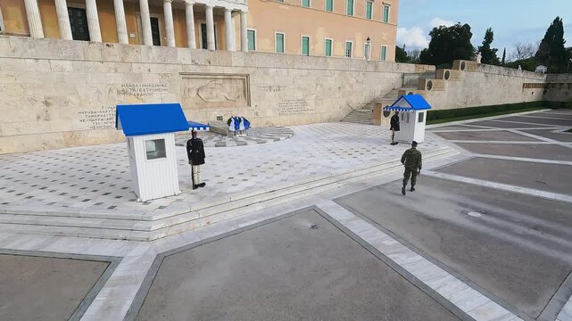Ceremonial changing of Evzoni guards at unknown soldier monument in Athens, Greece, aerial shot