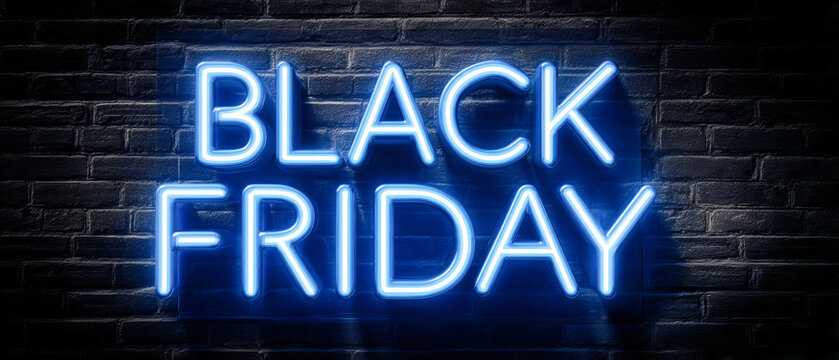A neon black Friday sign illuminates a dark wall with studio lighting. The reflective background enhances the glow, creating an inviting retail atmosphere