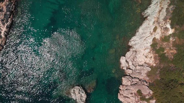 Vertical Aerial View of Porto Timoni Beach Double Bay and Turquoise Sea in Corfu Greece