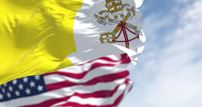 Vatican city flag waving in the wind with the American flag on a clear day. Leo XIV is the first American pope. Seamless 3d render animation. Slow motion loop. Selective focus