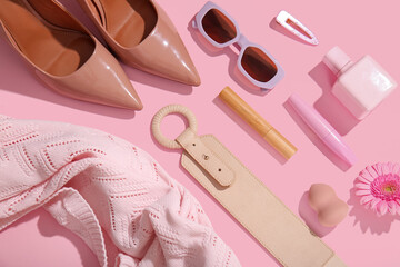 Plakat Composition with stylish female accessories, cosmetics and clothes on pink background