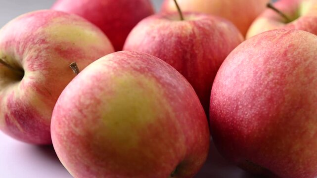Fresh Red Apples Rotating on Black Background in Real Time
