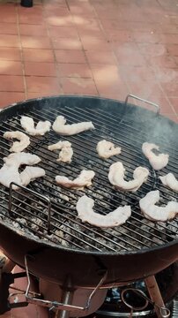 Vertical footage of grilled intestines to crispy texture. Chinchulin is the small intestine of an cow used in cooking, especially in Argentine, Uruguayan, and Paraguayan cuisine. High quality 4k