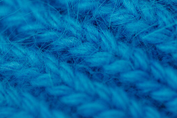 Obraz premium Blue knitted textile texture macro, soft fabric pattern background, cozy material concept, abstract design.