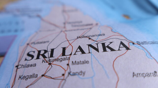 Close-up of Sri Lanka map displaying major cities like Kandy, Matale, and Polonnaruwa. Transportation routes and geographic features of the island nation.