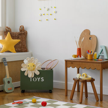 Children room corner featuring a green toy storage box, plush star pillow, daisy soft toy, and a warm palette &mdash; a playful and cozy corner for play and rest.