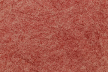 Fototapeta premium Paper with texture shows shades of pink and brown with visible fibers and patterns throughout the surface