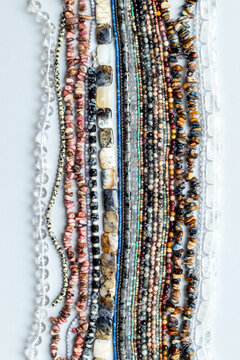 Lot of chains of gemstones and pearls beads for jewelry, top view
