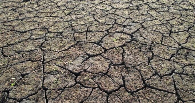 dry land in the dry season Drought, ground cracks, no hot water. Lack of humidity effect from global cracked soil in drought abstract nature background with cracked soil