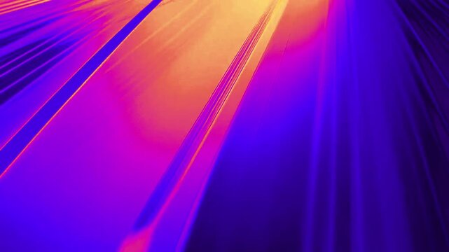 Abstract blue background with diagonal lines fading into vibrant orange stripes in smooth motion.