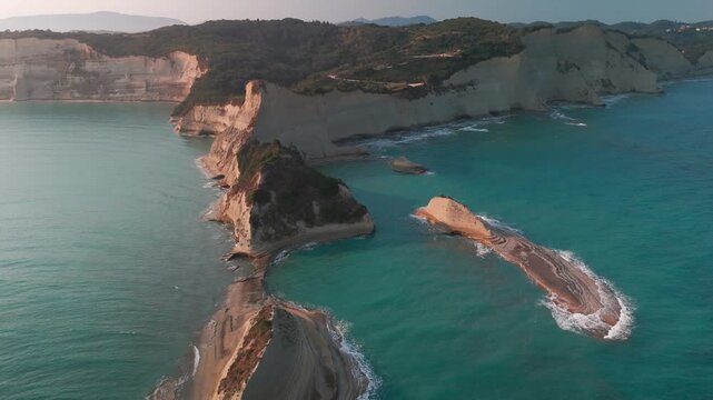Aerial Boomerang Flight Over White Sandstone Cliffs and Sea Stacks at Cape Drastis Corfu