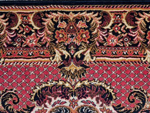Horizontal oriental rug border with floral ornament, red vintage carpet panoramic texture