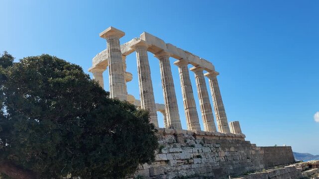 Panorama of the ancient temple of Poseidon at cape Sounion near Athens in Greece on summer sunny day