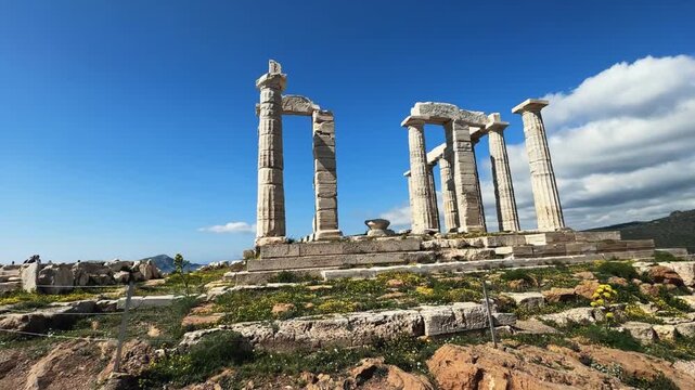 Panorama of the ancient temple of Poseidon at cape Sounion near Athens in Greece on summer sunny day