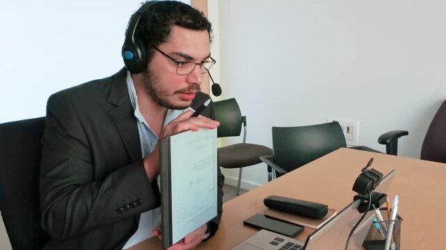Remote Project: Man Taking Notes on Tablet