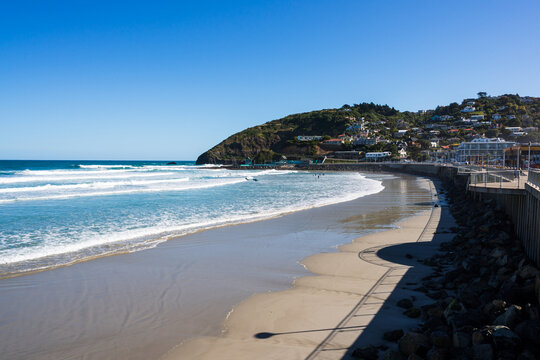 Headland with surfing beach and shadows