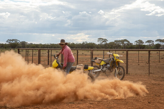 Man doing donuts on a dirt bike