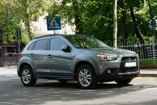 Bucharest, Romania &ndash; April 28, 2026: Closeup front side of Mitsubishi ASX ClearTec SUV gray car parked on street