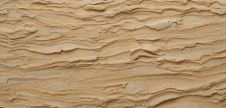 Close-up of layered, beige-colored sedimentary rock or clay formation