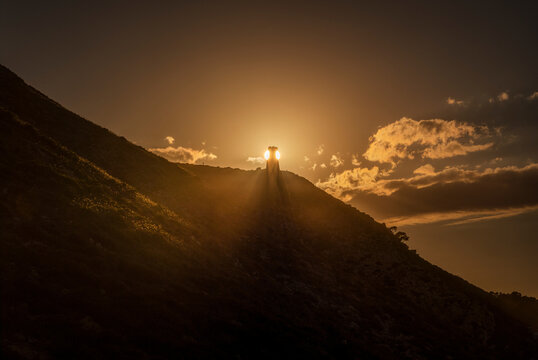 Dramatic Sunset Landscape with Torre del Gerro Ancient Watchtower Silhouette