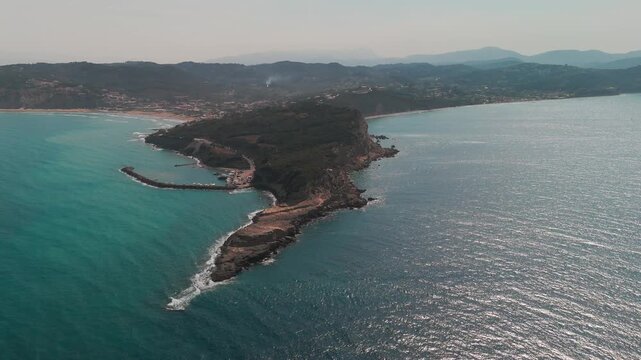 Drone View of Cape Kefali Rugged Peninsula between Agios Stefanos Port and Arillas Bay Corfu