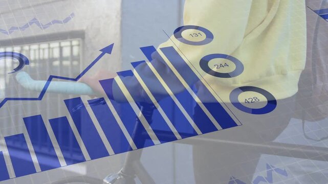 Camera tracking man walking holding bicycle while commuting, causing blue transport charts rising