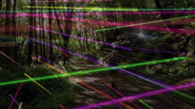 Woman walking woods trail, phone light sparking streaks sweeping over hiker for recreation tech