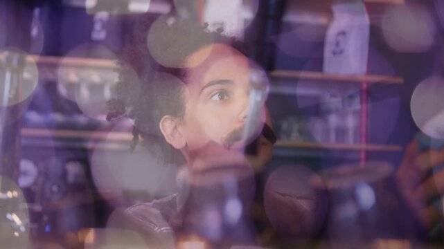 Bartender noticing top light looking up, reaching taps, pouring beer at bar, bokeh overlay shifting