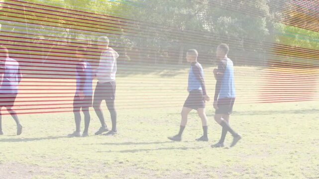 Soccer defenders walking into goal while attackers advancing, forming wall with overlay lines