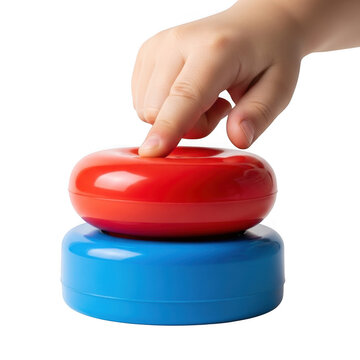 A child's hand pressing a red button on a blue base