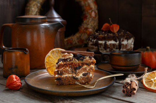 Slice of Homemade Pumpkin Cake Torte with walnuts, prunes and creme.