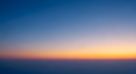 Fototapeta premium Abstract sunset gradient background with soft transition from deep blue to orange and purple, minimalist atmospheric sky texture for design