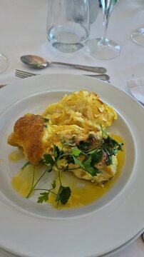 Traditional Portuguese cod loin with mashed potatoes, Bacalhau &agrave; Z&eacute; do Pipo, elegantly plated and ready to eat.