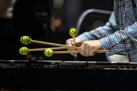  Hands of a girl playing the vibraphone