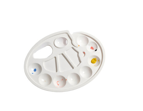 White oval palette with colorful paint spots