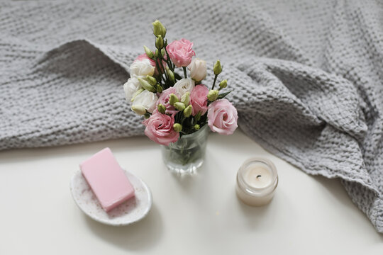 top view of natural decorated homemade soap with flowers on white surface. spa organic soap. Natural vegan soap with rose fragrance