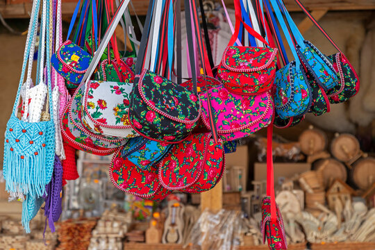 Background with bags embroidered and decorated with specific patterns of the Maramures area, Romania, exposed for sale at one traditional fair.