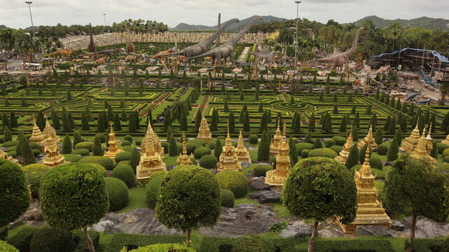 View of the Garden at Nong Nooch Tropical Botanical Garden with Thai Pagodas and Geometric Topiary in Pattaya