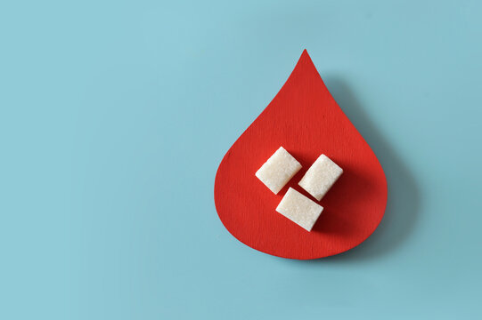 Blood Sugar Concept with Sugar Cubes Inside Red Drop