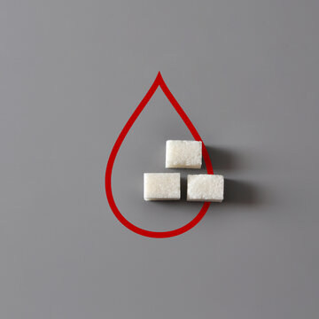 Blood Sugar Concept with Sugar Cubes Inside Red Drop