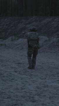 Night tactical training session of soldiers at outdoor firing range